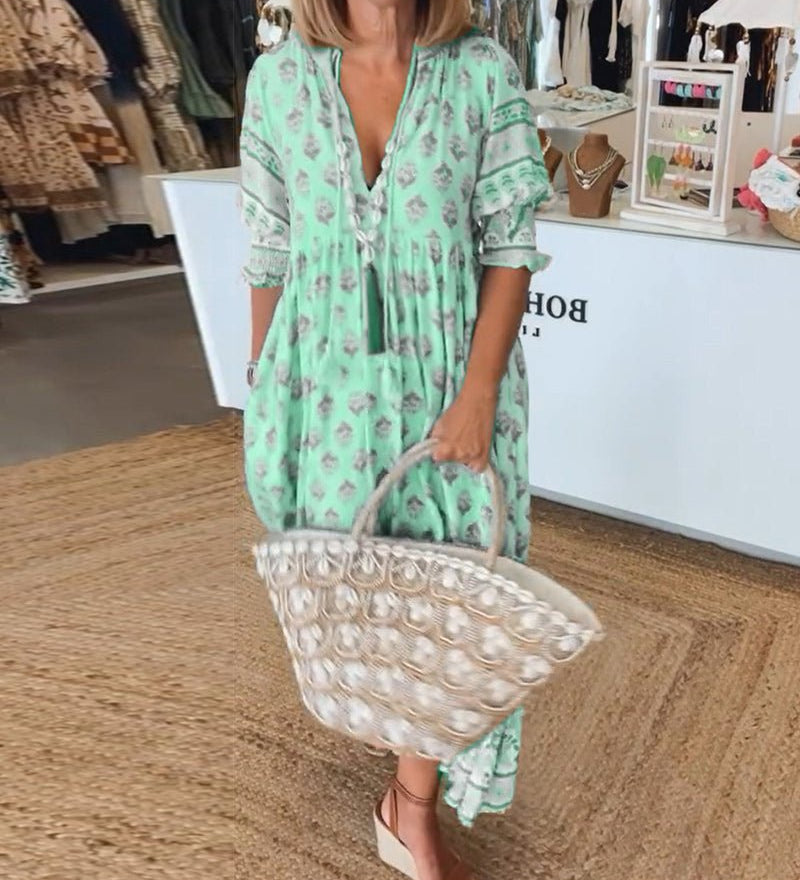 Marit | Chique midijurk met bloemenprint en V-hals